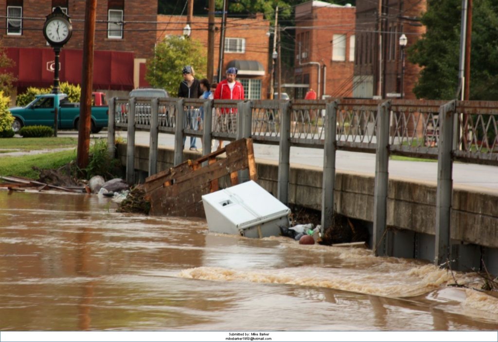 Flooded streets in carter county kentucky. Olive Hill strong has been working to make community plans involving the Galaxy project youth