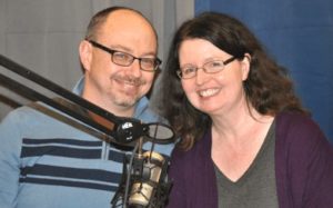 Two people pose in front of a microphone for Front Porch Studio in berea kentucky