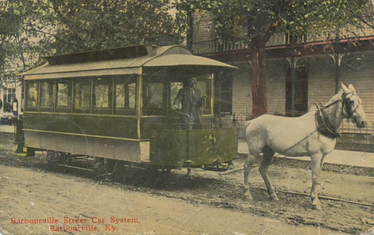 a horse pulls a street car through downtown in 1900s barbourville kentucky