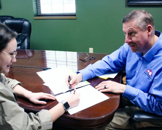 James with Redbud Financial Alternatives sits down with a client