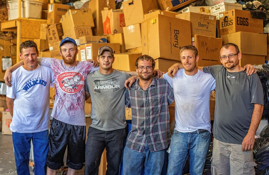 Group of employees at the Methodist Mountain Mission warehouse in eastern kentucky. Photo by Malcolm Wilson, appalachian artist.