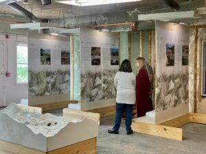 Two people look at the exhibit in HAzard KY